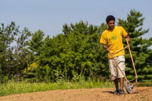 Crew Member learning to use a Wheel Hoe.